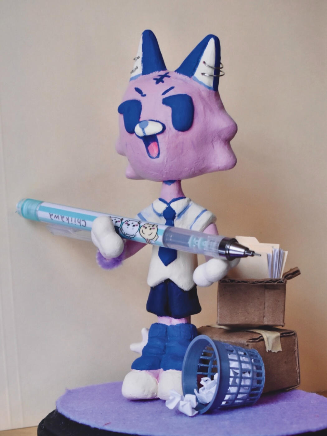 made with craft sculpey, felt, cardboard & paper, on a wood base